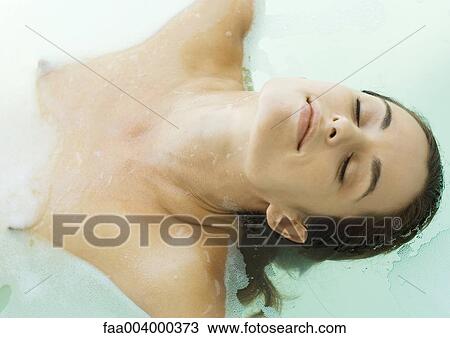 Woman in bath with eyes closed View Large Photo Image Stock Image - Woman in bath with eyes closed. Fotosearch