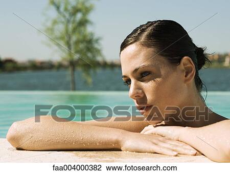 Woman leaning on edge of pool View Large Photo Image Stock Image - Woman leaning on edge of pool. Fotosearch