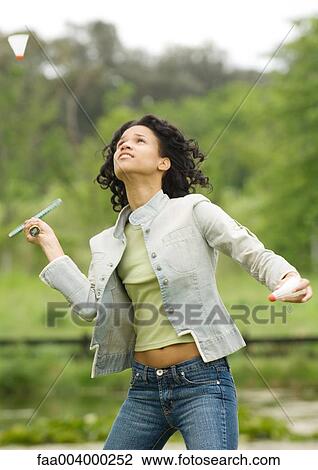 Woman playing badminton View Large Photo Image Stock Image - Woman playing badminton. Fotosearch
