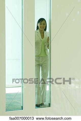 Woman seen through rectangular window View Large Photo Image Stock Image - Woman seen through rectangular window. Fotosearch