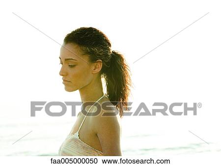 Stock Image - Woman, side view, portrait. Fotosearch