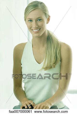 Stock Image - Woman smiling, portrait. Fotosearch