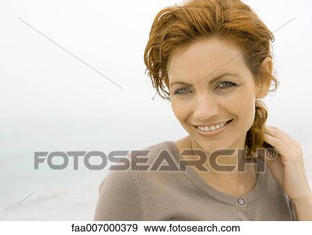 Stock Photo - Woman smiling . Fotosearch