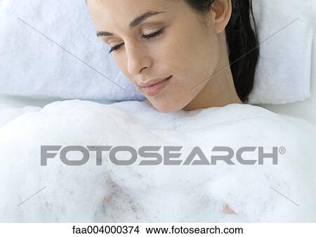 Picture - Woman taking bubble bath. Fotosearch