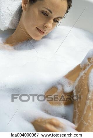 Woman taking bubble bath View Large Photo Image Stock Photo - Woman taking bubble bath. Fotosearch