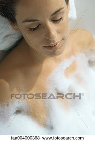 Woman taking bubble bath View Large Photo Image Stock Photo - Woman taking bubble bath. Fotosearch