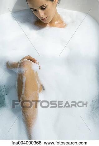Woman taking bubble bath View Large Photo Image Stock Photograph - Woman taking bubble bath. Fotosearch