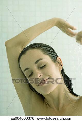 Woman taking shower, arms up and eyes closed View Large Photo Image Stock Photograph - Woman taking shower, arms up and eyes closed. Fotosearch