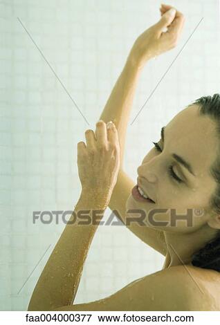 Stock Photo - Woman taking shower. Fotosearch