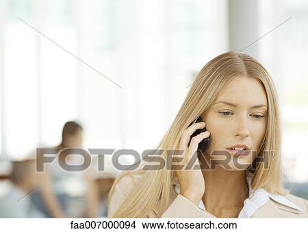 Woman using cell phone View Large Photo Image Picture - Woman using cell phone. Fotosearch