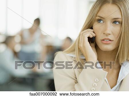 Woman using cell phone View Large Photo Image Stock Image - Woman using cell phone. Fotosearch