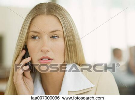 Woman using cell phone View Large Photo Image Stock Photograph - Woman using cell phone. Fotosearch