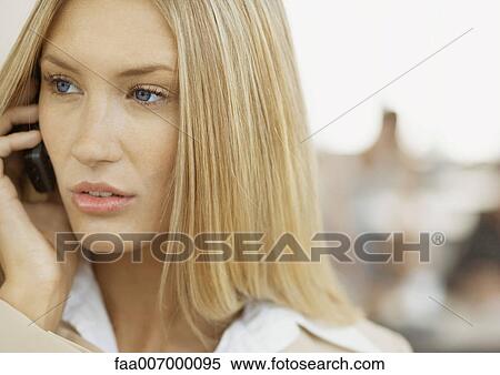 Woman using cell phone View Large Photo Image Stock Photography - Woman using cell phone. Fotosearch