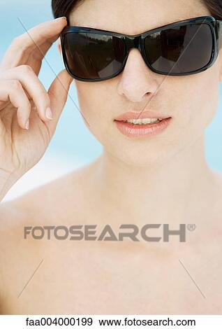 Woman wearing dark sunglasses View Large Photo Image Stock Photo - Woman wearing dark sunglasses. Fotosearch