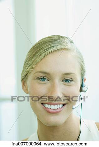 Woman wearing headset View Large Photo Image Picture - Woman wearing headset. Fotosearch