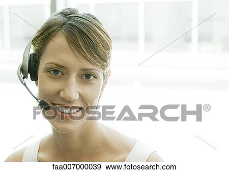 Woman wearing headset View Large Photo Image Stock Photo - Woman wearing headset. Fotosearch