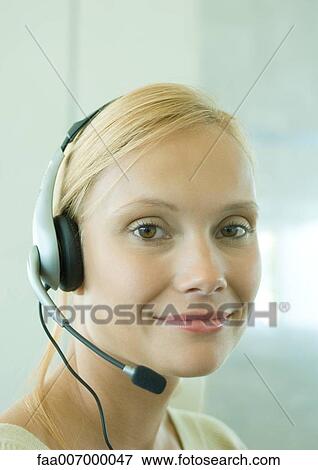 Woman wearing headset View Large Photo Image Stock Photo - Woman wearing headset. Fotosearch