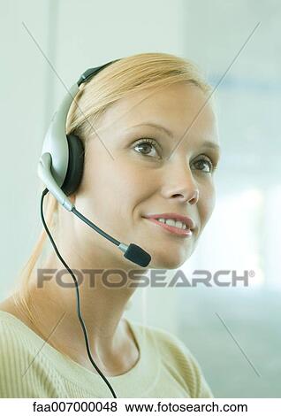 Woman wearing headset View Large Photo Image Stock Photo - Woman wearing headset. Fotosearch