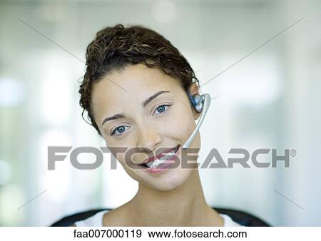 Woman wearing headset View Large Photo Image Stock Photo - Woman wearing headset. Fotosearch