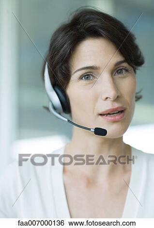 Woman wearing headset View Large Photo Image Stock Photograph - Woman wearing headset. Fotosearch