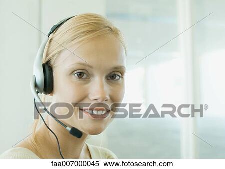 Woman wearing headset View Large Photo Image Stock Photography - Woman wearing headset. Fotosearch