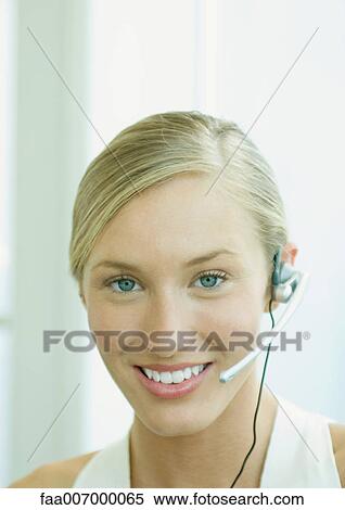 Woman wearing headset View Large Photo Image Stock Photography - Woman wearing headset. Fotosearch