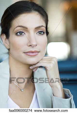 Picture - Woman with hand under chin, close-up, portrait. Fotosearch