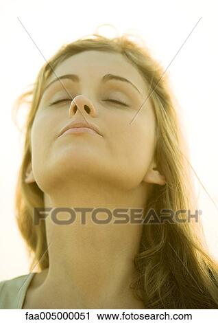 Woman with head back and eyes closed View Large Photo Image Stock Image - Woman with head back and eyes closed. Fotosearch