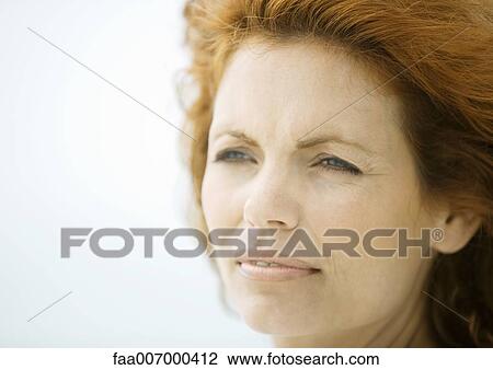 Stock Image - Woman's face, looking away. Fotosearch