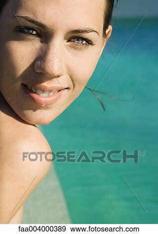 Woman's face, next to swimming pool, close-up View Large Photo Image Stock Photo - Woman's face, next to swimming pool, close-up. Fotosearch
