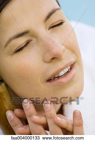 Woman's face with eyes closed View Large Photo Image Stock Image - Woman's face with eyes closed. Fotosearch