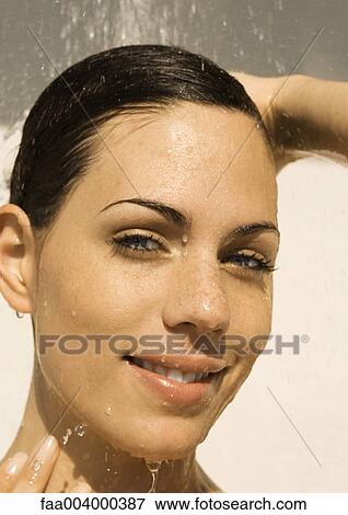 Woman's smiling face under shower View Large Photo Image Stock Photo - Woman's smiling face under shower. Fotosearch