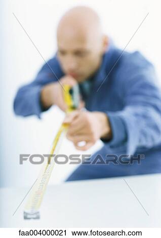 Worker with measuring tape View Large Photo Image Stock Image - Worker with measuring tape. Fotosearch