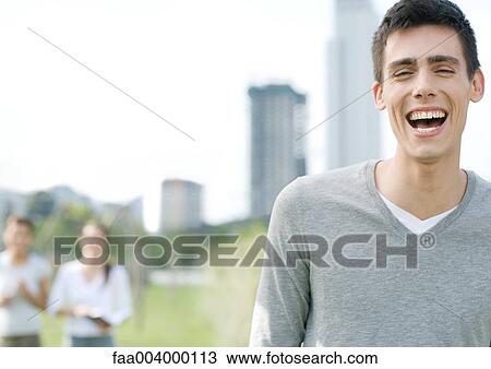 Young man laughing View Large Photo Image Stock Image - Young man laughing. Fotosearch