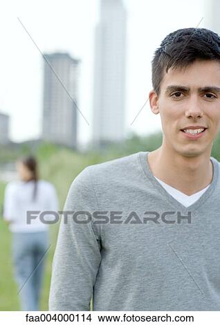 Picture - Young man looking at camera. Fotosearch