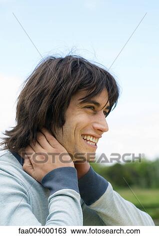 Young man smiling, portrait View Large Photo Image Stock Image - Young man smiling, portrait. Fotosearch