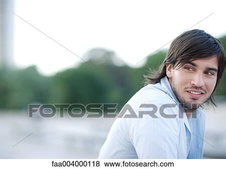 Young man smiling View Large Photo Image Stock Photo - Young man smiling. Fotosearch