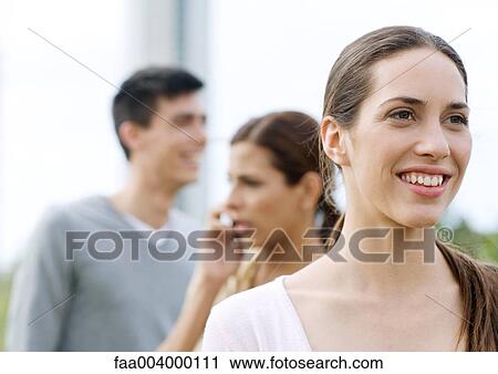 Stock Image - Young woman smiling. Fotosearch