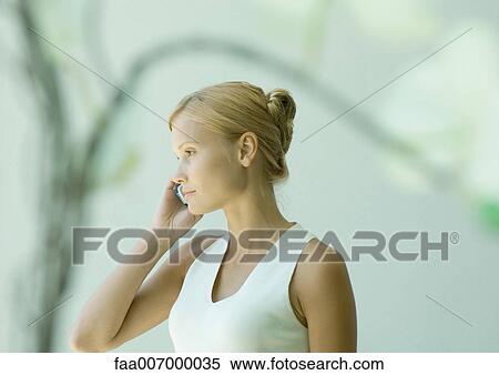 Young woman using cell phone View Large Photo Image Stock Photography - Young woman using cell phone. Fotosearch