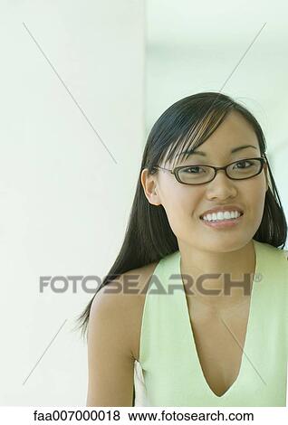 Young woman wearing glasses, portrait View Large Photo Image Stock Photo - Young woman wearing glasses, portrait. Fotosearch