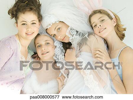 Stock Photo - Four preteen girls dressed up in costumes. Fotosearch