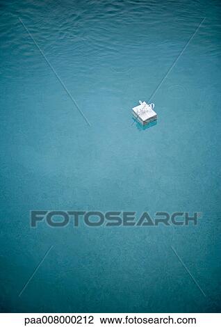 Stock Image - Gift floating in water. Fotosearch