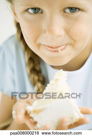 Girl eating cake View Large Photo Image Stock Photograph - Girl eating cake. Fotosearch