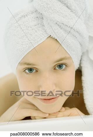 Girl with towel wrapped around head View Large Photo Image Stock Photograph - Girl with towel wrapped around head. Fotosearch
