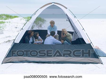 Group of young adults in tent on beach View Large Photo Image Stock Photography - Group of young adults in tent on beach. Fotosearch
