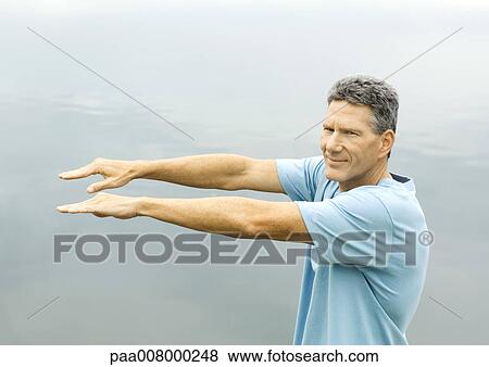 Man exercising outdoors View Large Photo Image Stock Photo - Man exercising outdoors. Fotosearch