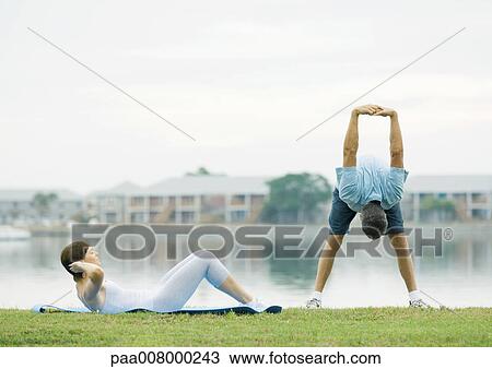 Mature couple exercising, lakeside View Large Photo Image Stock Image - Mature couple exercising, lakeside. Fotosearch