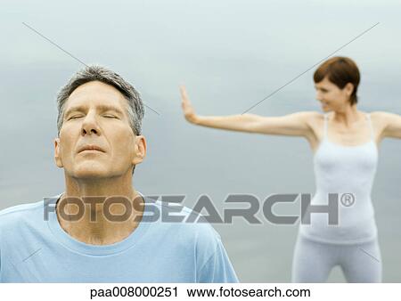 Stock Image - Mature couple exercising. Fotosearch
