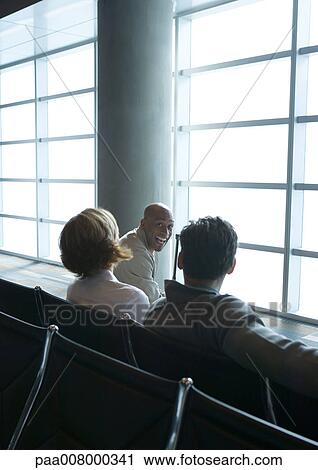 Stock Image - People in airport lounge. Fotosearch
