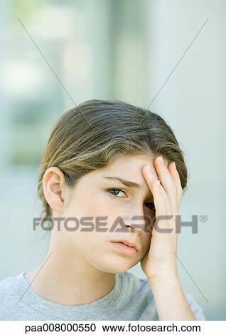 Preteen girl holding head View Large Photo Image Stock Image - Preteen girl holding head. Fotosearch